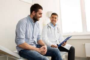 Doctor speaking with male patient