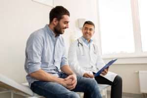 A doctor consulting with an injured worker