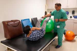 Occupational therapist working with a male patient