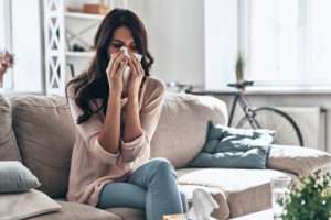 Female patient blowing her nose